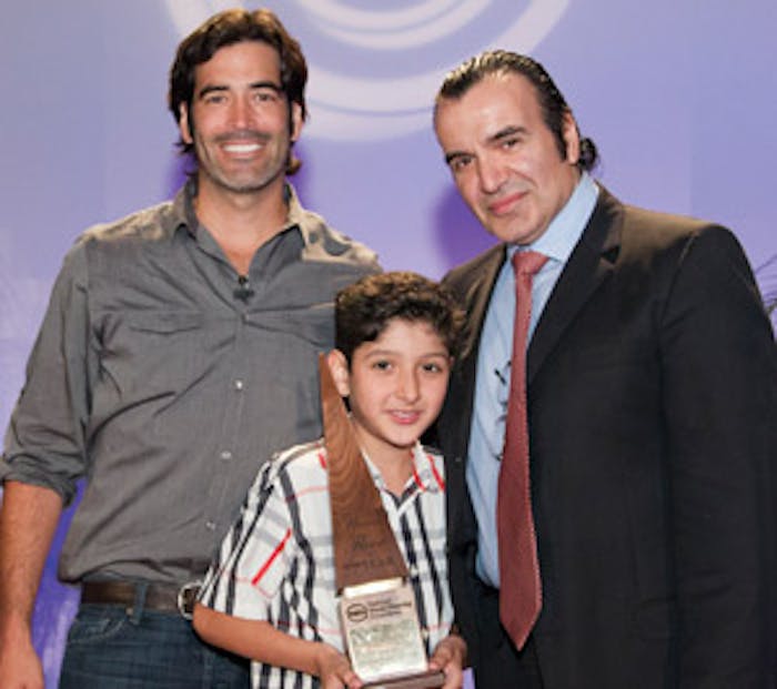 Avedis Duvenjian of Wood Floor of the Year Members' Choice winner Archetypal Imaginary Remodeling Corp. and his son Tigran with HGTV celebrity Carter Oosterhouse (left) at the 2012 NWFA Expo in Orlando, Fla., on April 12. (Photo courtesy David Stluka)