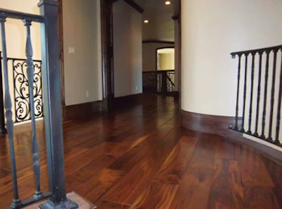 This prefinished, hand-scraped walnut floor was cleaned and recoated using a chemical recoating system; the floor had extensive surface scratches and excessive grime build-up after five years of use. (Photo courtesy of Basic Coatings and Provo, Utah-based Jerry Nielson Hardwood)