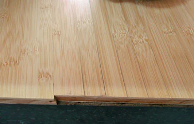 Glue line failure in a traditional horizontal engineered floor.