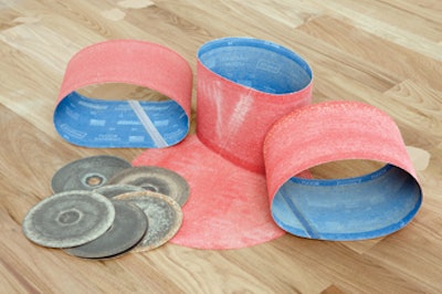 Image of used sanding belts and discs