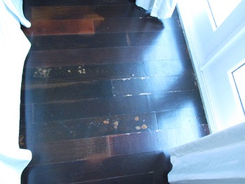 photo of wood floor with blister problem