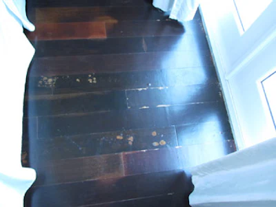 photo of wood floor with blister problem