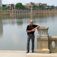 On the promenade at Lake Mirror in Lakeland, Fla., wood flooring contractor Paul Williford takes a short break from his day's job-site visits and client meetings.