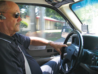 Wearing a Bluetooth earpiece and with a GPS navigator on his dash, Williford stays connected with his employees and lessens his chances of getting lost in Lakeland's winding suburbs.