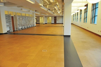 (AFTER) In the after photo, you can see that after sanding and finishing all the natural tiles now blend together as they should, and the brown cork has been restored to its correct color, too.