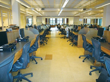 (BEFORE) This photo shows the computer desks that couldn't be moved, requiring extensive hand-sanding.