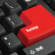 photo of keyboard with large red backup button