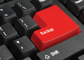 photo of keyboard with large red backup button