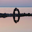 photo of balanced rocks on shoreline