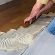 photo of flooring installation showing adhesives