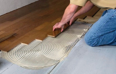 photo of flooring installation showing adhesives