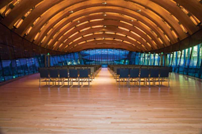 Crystal Bridges' founder, Alice Walton, strove to build the museum using as many regionally made building products as possible, including laminated ceiling beams and wood flooring.