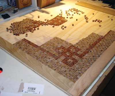 Contractor Jack Campbell made the inlay by gluing together more than 25,000 bits of wood.