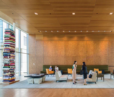 In the reception area, Seattle-based Northwest Millworks installed end-grain alder on walls and ceiling portions, while the GC also installed cherry-colored acoustic ceiling cladding made by Decoustics.