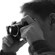 photo of a guy using a camera