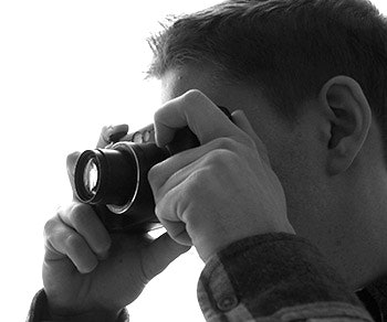 photo of a guy using a camera