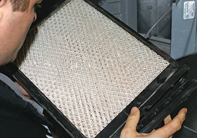 This homeowner said that Aprilaire humidification systems were in place on both furnaces in the home, but a quick check revealed that the filters were dry and there was no water in the drain hoses. (Photo by Scott Taylor)