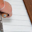 photo of someone applying wood flooring adhesive
