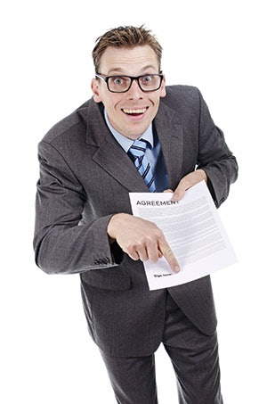 photo of man pointing to a form needing a signature