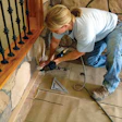 photo of a person working on flooring