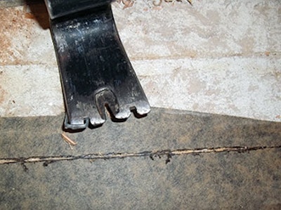 photo of a prybar used in tearing out flooring