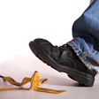 photo of a man about to step on a banana peel