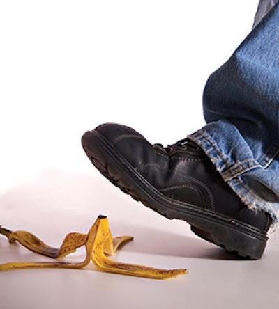 photo of a man about to step on a banana peel