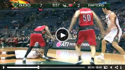 The Milwaukee Bucks' O.J. Mayo slides across the slick floor.