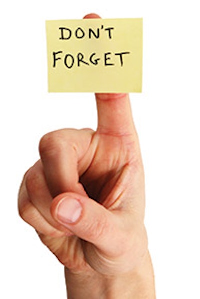 photo of a hand with a post-it note on the finger