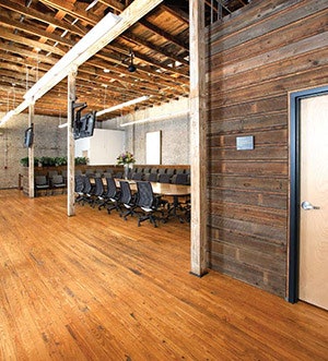 Reclaimed wood siding used as wall cladding on the third floor conference room. (Mark Lamkin Photography)