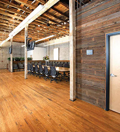Reclaimed wood siding used as wall cladding on the third floor conference room. (Mark Lamkin Photography)