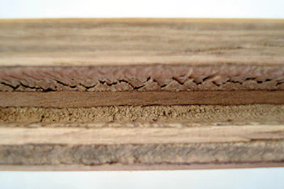 The retailer assumed this floor was a simple case of delamination. Destructive testing, however, showed that wood fiber tearing apart due to environmental changes, not a problem with the glue bond, was the issue.