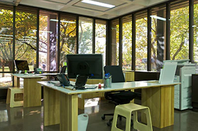 photo of desks made from wooden floorboards