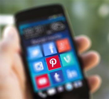 photo of a phone showing a Pinterest logo
