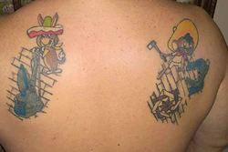 Manny Navarro shows off the wood flooring tattoos on his back.