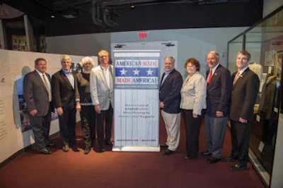 Wayne Cotton and Don Finkell, fourth and fifth from the left, pose with guests. Photo: David Stluka Photography