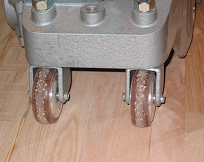 When sanding any pine floor, be sure to clean big machine and edger wheels frequently, as they may load up with resin just like your abrasive does, causing uneven sanding.