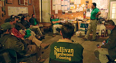 Alan Sullivan discusses the day’s projects with the staff.