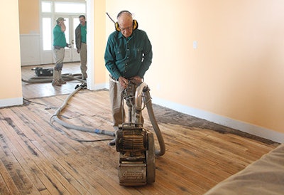 Paul Sullivan, Alan’s 78-year-old father, prefers drum sanders. Here he sands years’ worth of grime off the Donoho Hotel floors with an American Super 83.