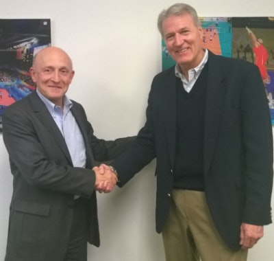 Gerflor CEO Bertrand Chammas (left) and Connor Sport Court International CEO Ron Cerny (right) shake hands following Gerflor's acquisition of Connor Sport Court International.