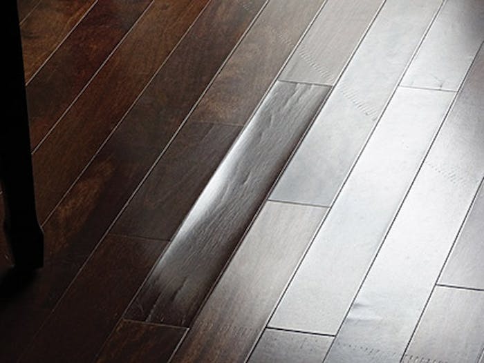 Low relative humidity caused checking and dry-cupping in this engineered wood floor. (Photo courtesy of Roy Reichow) - Click to enlarge