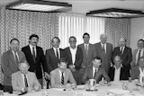 At this meeting in St. Louis in December 1985, the National Wood Flooring Association was officially created. Seen are (seated, left to right): Jack Wilcox, H.G. Roane Company; Ralph Singer, Diamond W Supply; Lon Musolf, Lon Musolf Distributing; Roland Holder, Gentry & Holder Floors; Harold Reid, Trinity Floor Company; (standing, left to right): Gary Reynolds, Galleher Hardwoods; Steve Brown, Swift-Brown Distributors; Art Pedicini, Geysir Sales Corporation; Jack Coates, Golden State Flooring; Richard Steeneck, Hoboken Wood Floors; Virgil Hendricks, Mid-West Floor Company; Eldon Robbins, Mid-West Floor Company; and Keijo Hyvonen, Kelly-Goodwin Company.
