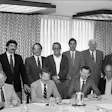At this meeting in St. Louis in December 1985, the National Wood Flooring Association was officially created. Seen are (seated, left to right): Jack Wilcox, H.G. Roane Company; Ralph Singer, Diamond W Supply; Lon Musolf, Lon Musolf Distributing; Roland Holder, Gentry & Holder Floors; Harold Reid, Trinity Floor Company; (standing, left to right): Gary Reynolds, Galleher Hardwoods; Steve Brown, Swift-Brown Distributors; Art Pedicini, Geysir Sales Corporation; Jack Coates, Golden State Flooring; Richard Steeneck, Hoboken Wood Floors; Virgil Hendricks, Mid-West Floor Company; Eldon Robbins, Mid-West Floor Company; and Keijo Hyvonen, Kelly-Goodwin Company.
