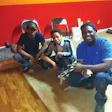 Burden's students after practicing how to stain a wood floor.