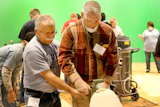 Bob Goldstein of Vermont Natural Coatings teaches sanding with the big machine at the National Wood Flooring Association (NWFA) Principles of Wood Flooring training course in March 2015.