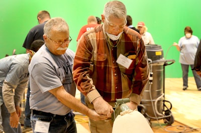 Bob Goldstein of Vermont Natural Coatings teaches sanding with the big machine at the National Wood Flooring Association (NWFA) Principles of Wood Flooring training course in March 2015.