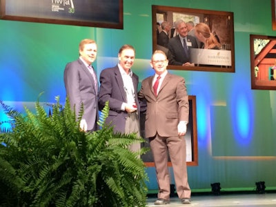 NWFA President and CEO Michael Martin, Rick Holden and NWFA Chairman Jeff Fairbanks pose with Holden's leadership award at the NWFA Expo in St. Louis.