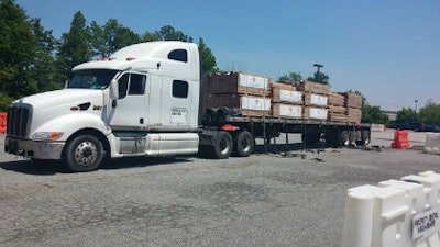 A truck carrying Aacer flooring arrives at Philadelphia Floor Store's temporary warehouse in Marcus Hook, Pa.