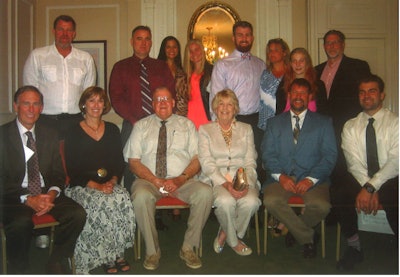 Chet Derr Jr. celebrated his 50th year with Derr Flooring Company at an event in Pennsylvania. (Top row, left to right: Corby Derr, Dave Derr Sr., Danielle Derr, Demi Balasa, Dave Derr Jr., Gig Balasa, Dayna Balasa, Dave Balasa. Seated, left to right: Rick Holden, Cathy Wood, Chet Derr Jr., Denny Derr, Chet Derr III, Andrew Derr.)