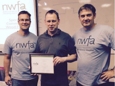 Kjell Nymark (left) and Rob Zehnder (right) pose with David Watson, the first citizen of the United Kingdom to receive an NWFACP certification.